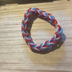 Homemade red white and blue rubber band bracelet
